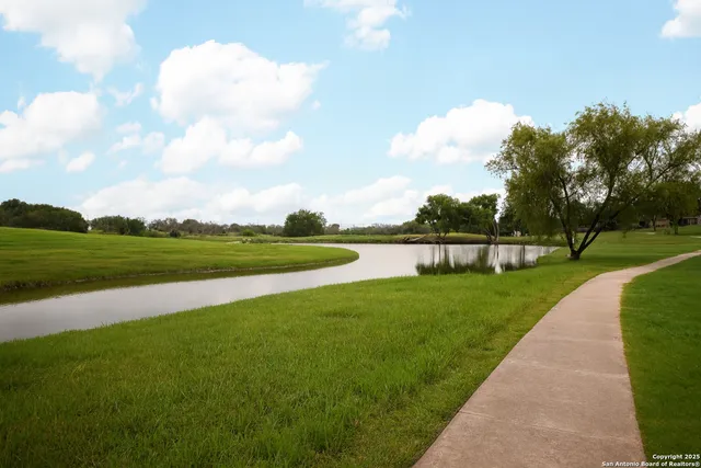 a view of a golf course with a lake