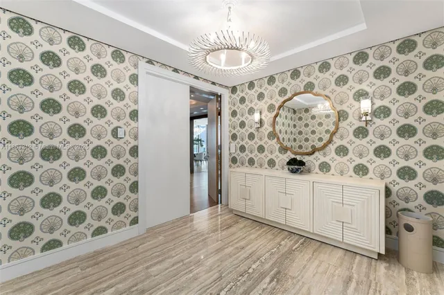a view of a livingroom with wooden floor and windows