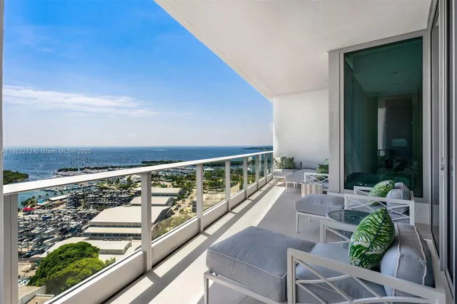 a view of swimming pool with outdoor seating