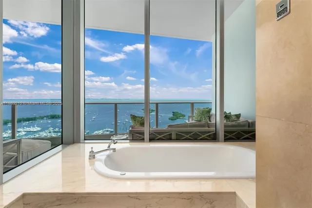 a bathroom with a tub and sink