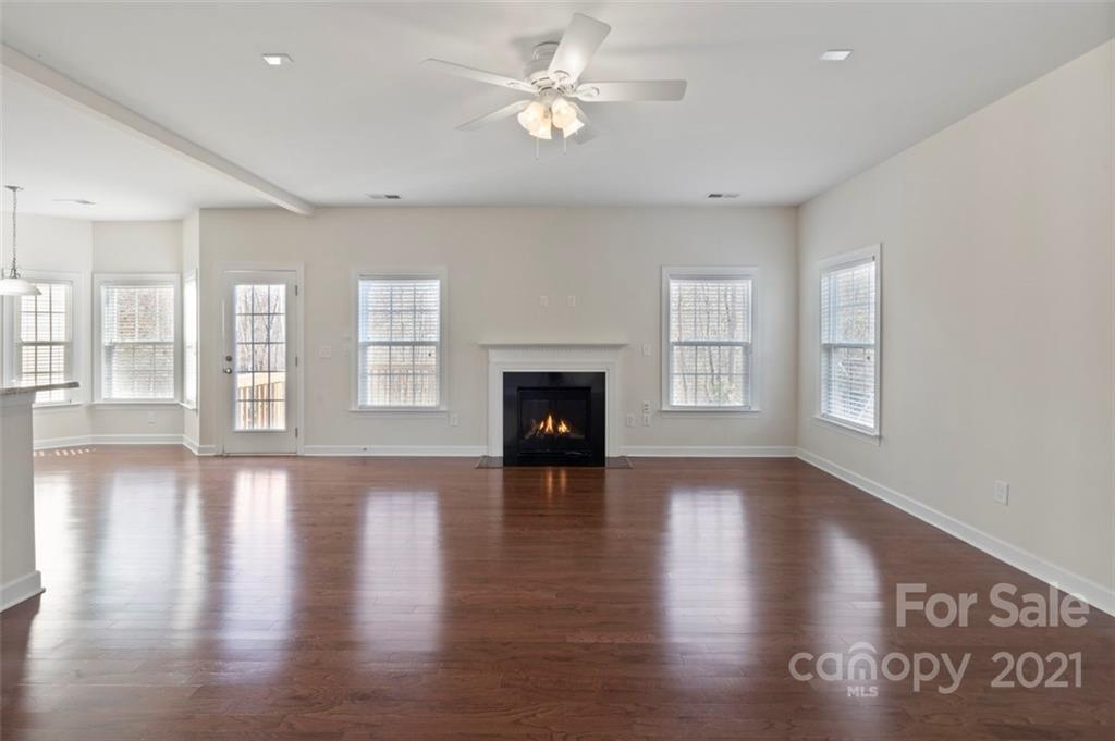 4331 Oxford Mill Road Waxhaw, NC 28173 - Photo 8 of 48 a view of an empty room with window and wooden floor
