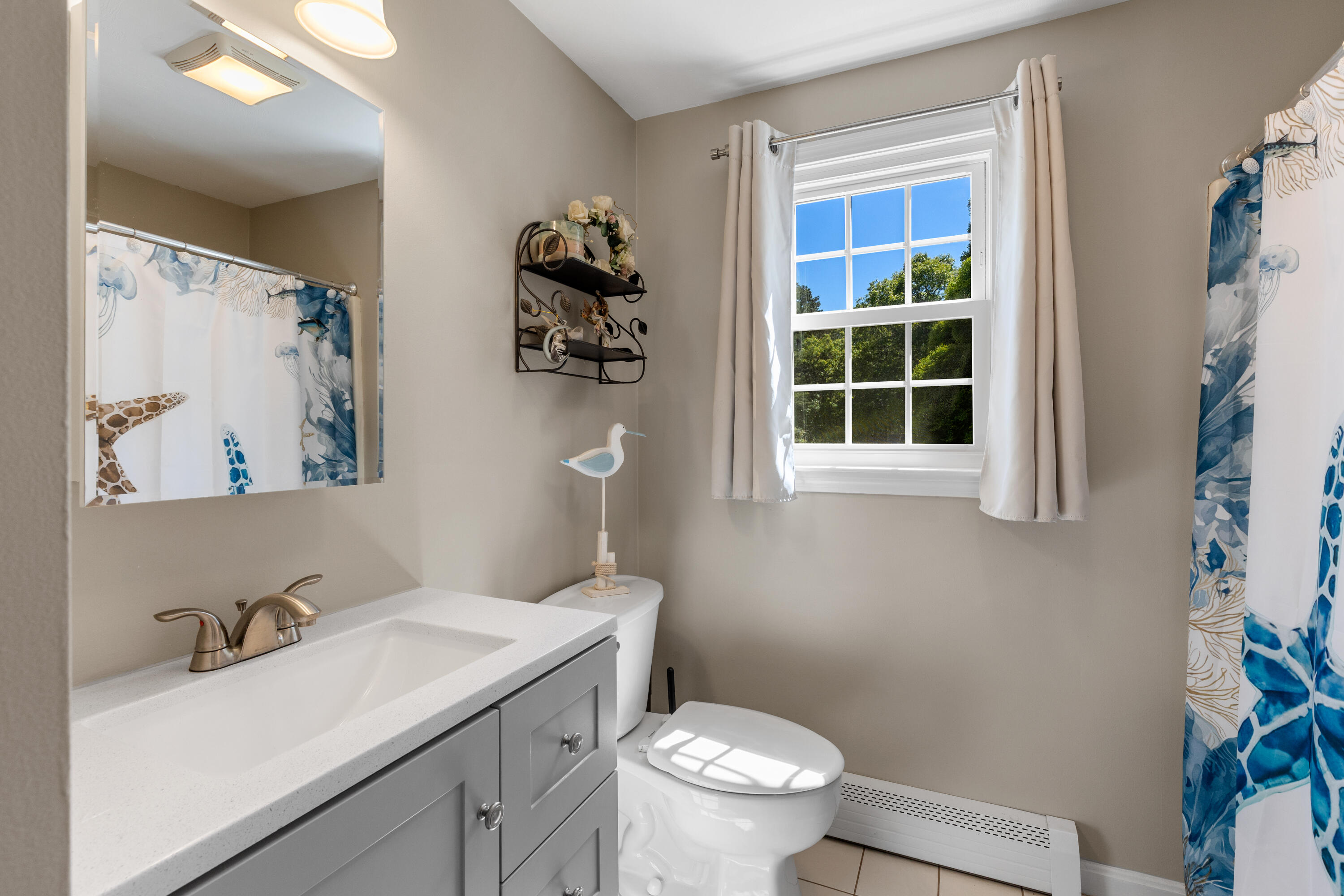 30 Sheffield Place Mashpee, MA 02649 - Photo 16 of 38 a bathroom with a sink toilet and vanity
