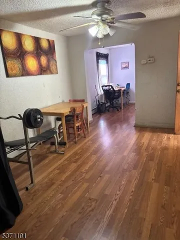 a view of a livingroom with furniture and a workspace