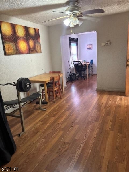669 Scotland Road, Unit 2 Orange, NJ 07050 - Photo 4 of 10 a view of a livingroom with furniture and a workspace