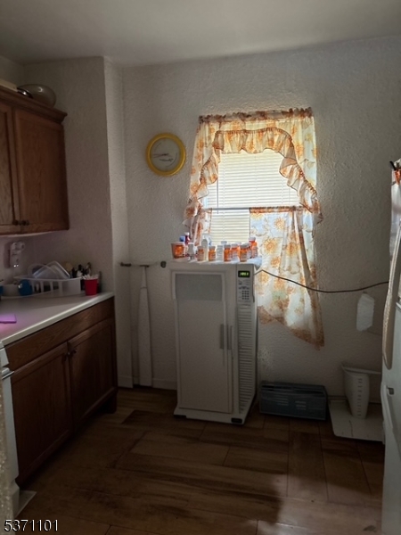 669 Scotland Road, Unit 2 Orange, NJ 07050 - Photo 5 of 10 a view of a bathroom with a sink and wooden floor