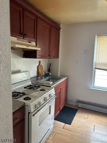 a bedroom with a bed and a television