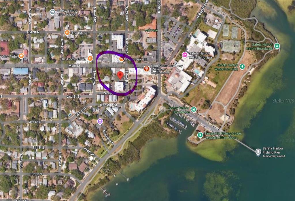 an aerial view of a house with swimming pool and outdoor space