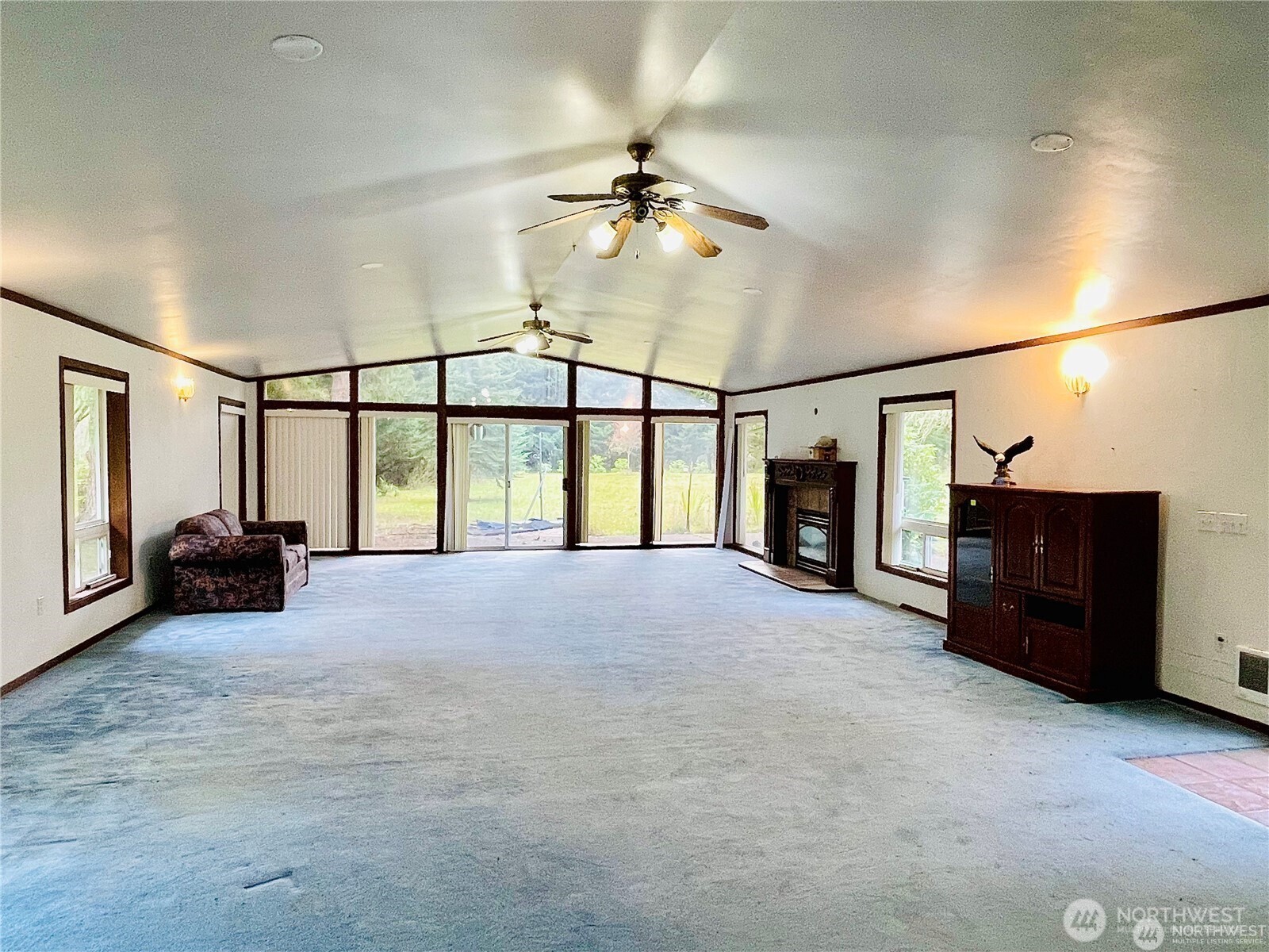 15407 264th Street East Graham, WA 98338 - Photo 5 of 23 a view of a livingroom with furniture a ceiling fan and window
