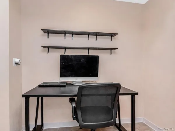 a workspace with furniture and window