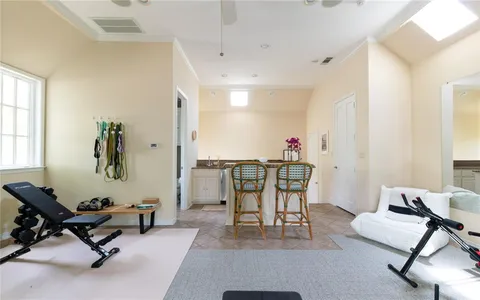 a living room with furniture a window and a table