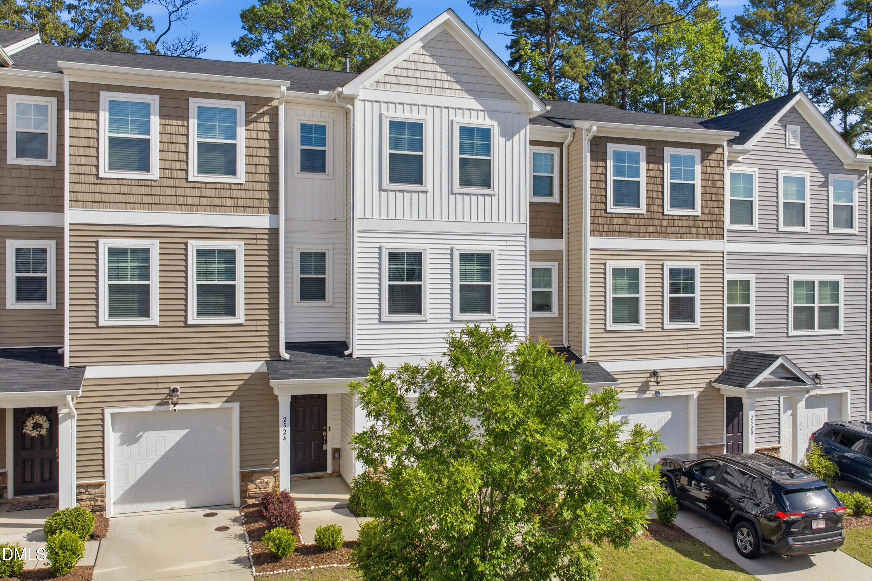 2524 Laurel Valley Way Raleigh, NC 27604 - Photo 2 of 12 a front view of a residential apartment building with a yard