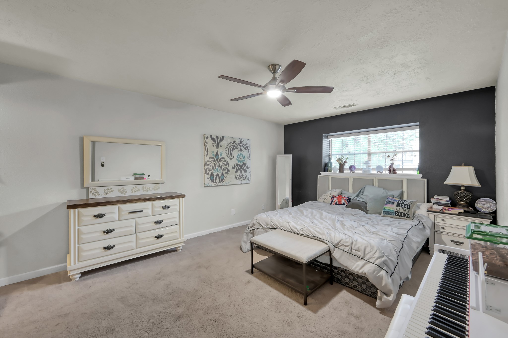 25610 Walnut Grove Circle Spring, TX 77380 - Photo 16 of 29 a bedroom with a bed and a dresser