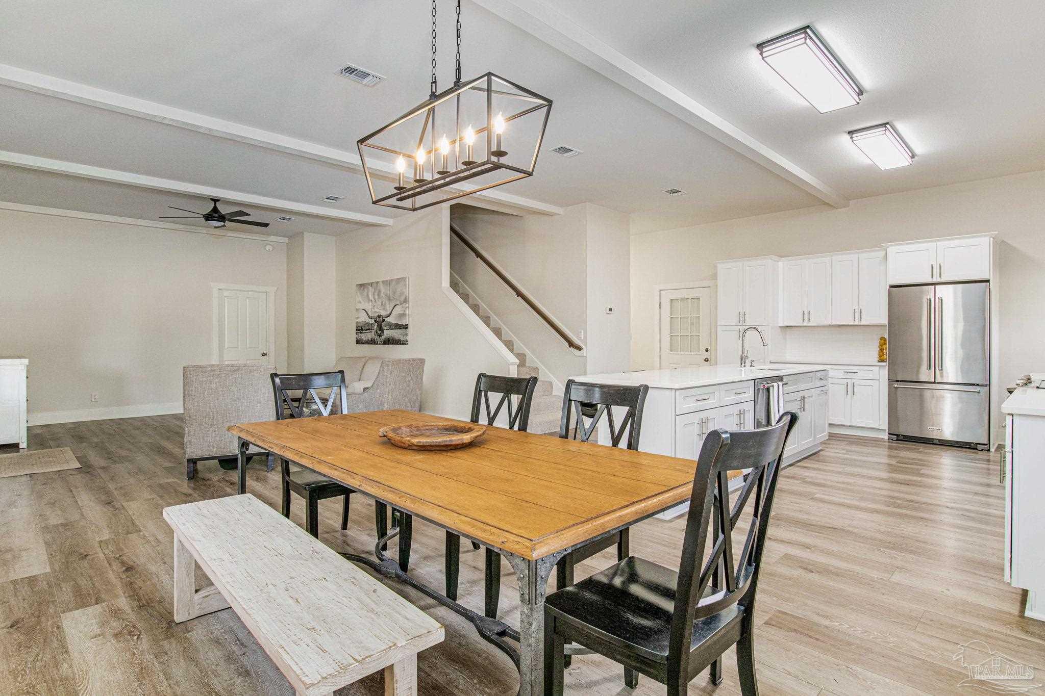4664 Kolb Road Milton, FL 32570 - Photo 19 of 20 a view of a dining room with furniture and wooden floor