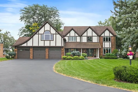 front view of a house with a small yard