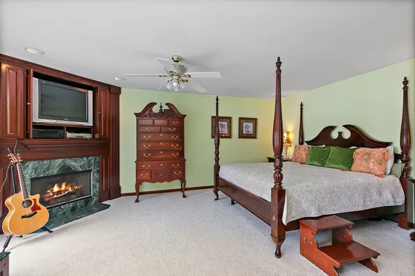 a bedroom with a bed and a dresser