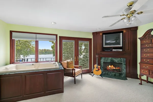 a bathroom with a double vanity sink toilet and shower