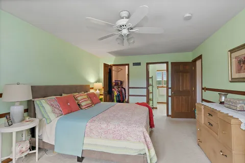 a bathroom with a sink mirror and toilet