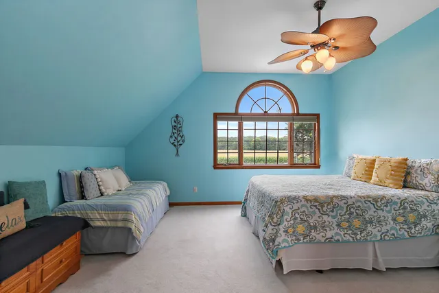 a kitchen with stainless steel appliances kitchen island granite countertop a refrigerator and cabinets