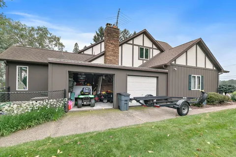 a view of a house with swimming pool and porch