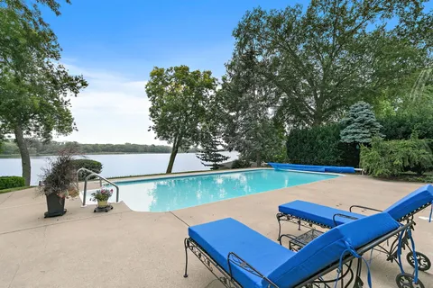 a view of a lake with outdoor seating