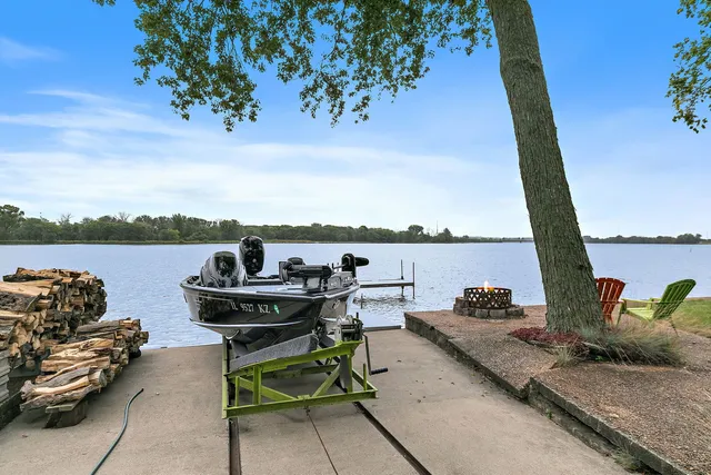 an aerial view of a house with garden space and lake view