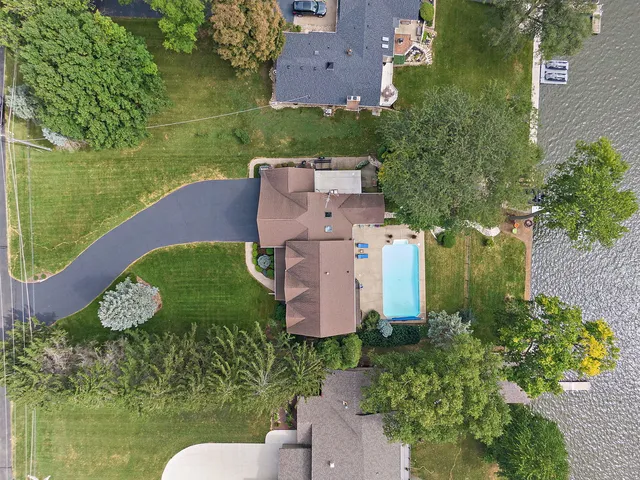 an aerial view of a houses with ocean view