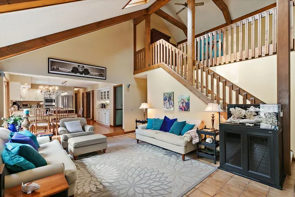 a living room with fireplace furniture and a flat screen tv