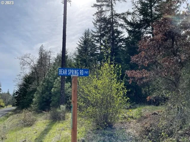 a view of a street sign next to a road