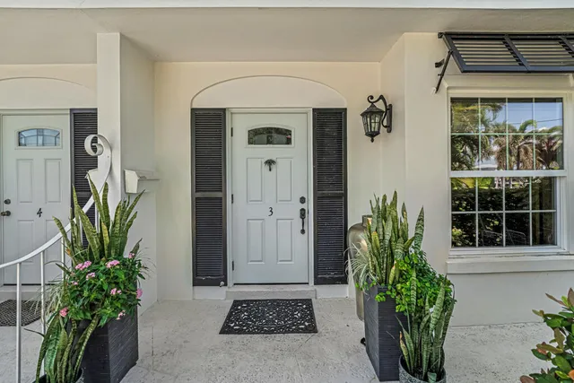 a front view of a house with a blue gate