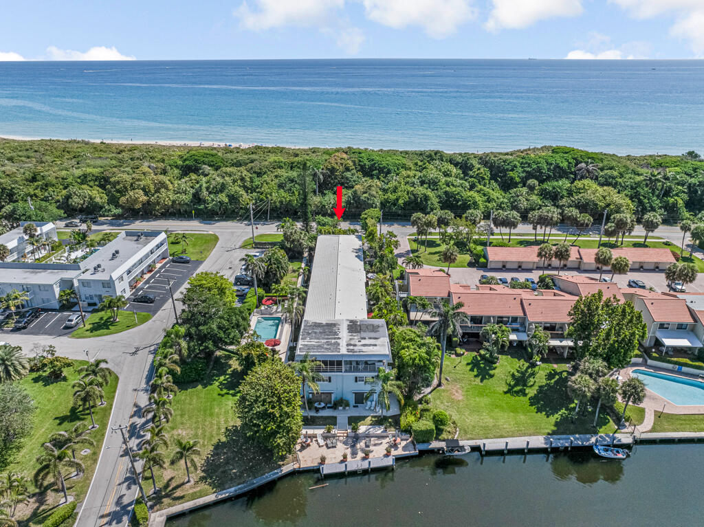 6590 North Ocean Boulevard, Unit 3 Ocean Ridge, FL 33435 - Photo 2 of 48 an aerial view of a house with a garden and lake view