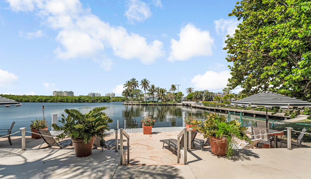 6590 North Ocean Boulevard, Unit 3 Ocean Ridge, FL 33435 - Photo 33 of 48 a view of a lake with couches chairs and a table