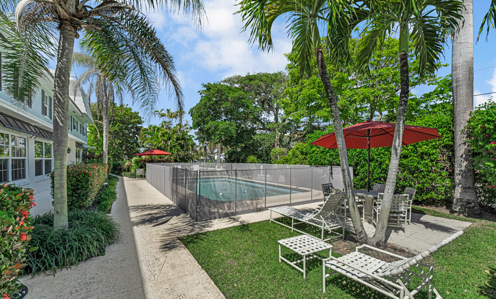 6590 North Ocean Boulevard, Unit 3 Ocean Ridge, FL 33435 - Photo 37 of 48 a view of a chair and table in backyard of the house