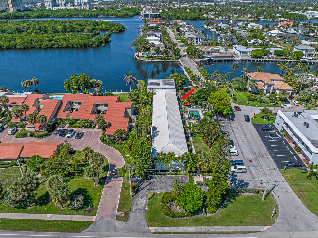 6590 North Ocean Boulevard, Unit 3 Ocean Ridge, FL 33435 - Photo 46 of 48 an aerial view of a house with a yard and lake view