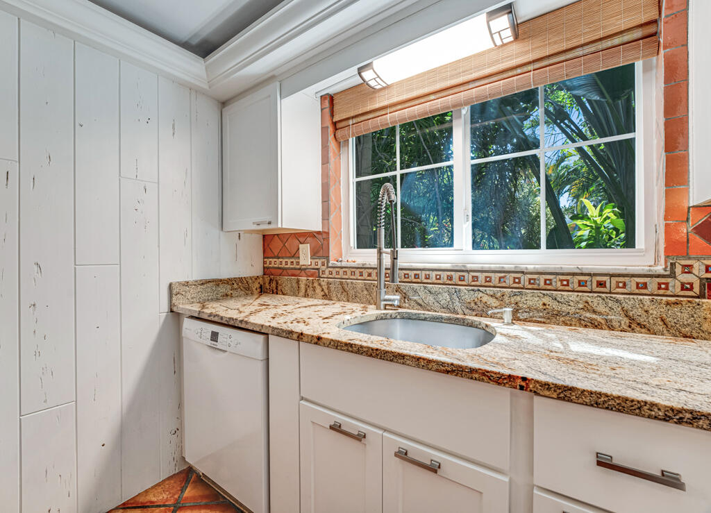6590 North Ocean Boulevard, Unit 3 Ocean Ridge, FL 33435 - Photo 6 of 48 a kitchen with a sink and a window