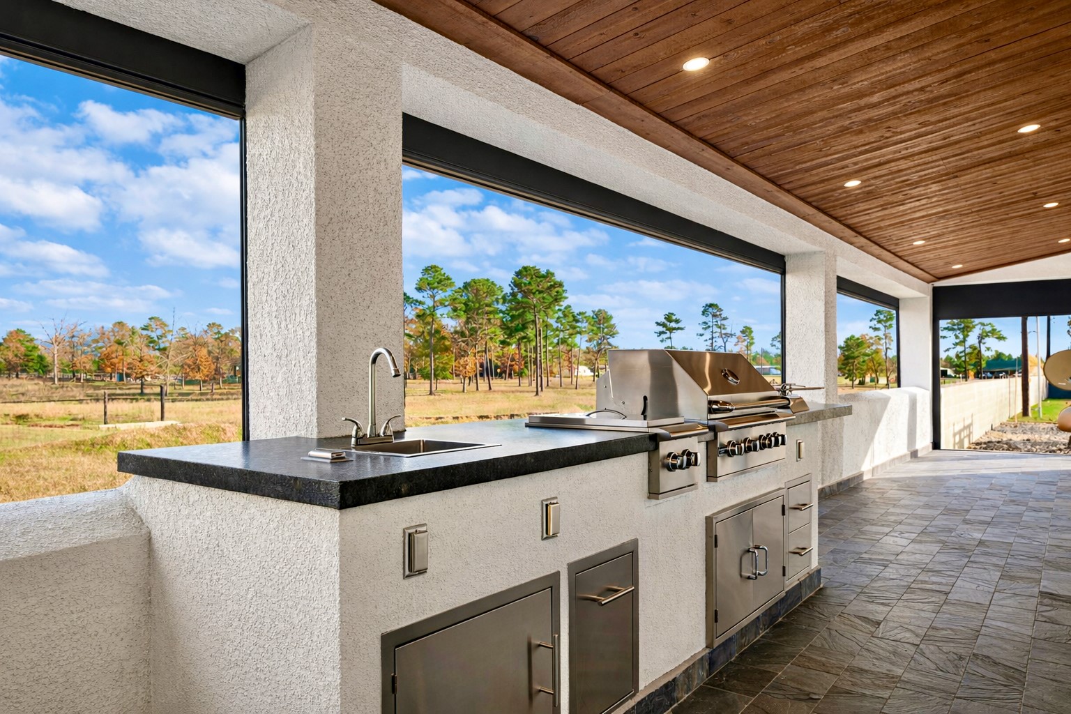 28811 Riley Road Waller, TX 77484 - Photo 27 of 50 a kitchen with stainless steel appliances granite countertop a stove and a refrigerator