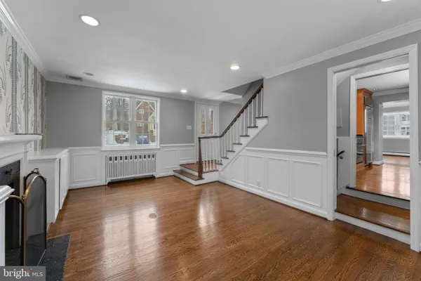a kitchen with stainless steel appliances granite countertop a refrigerator a sink and a stove