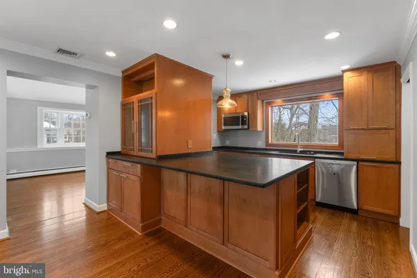 a kitchen with granite countertop a sink and a window