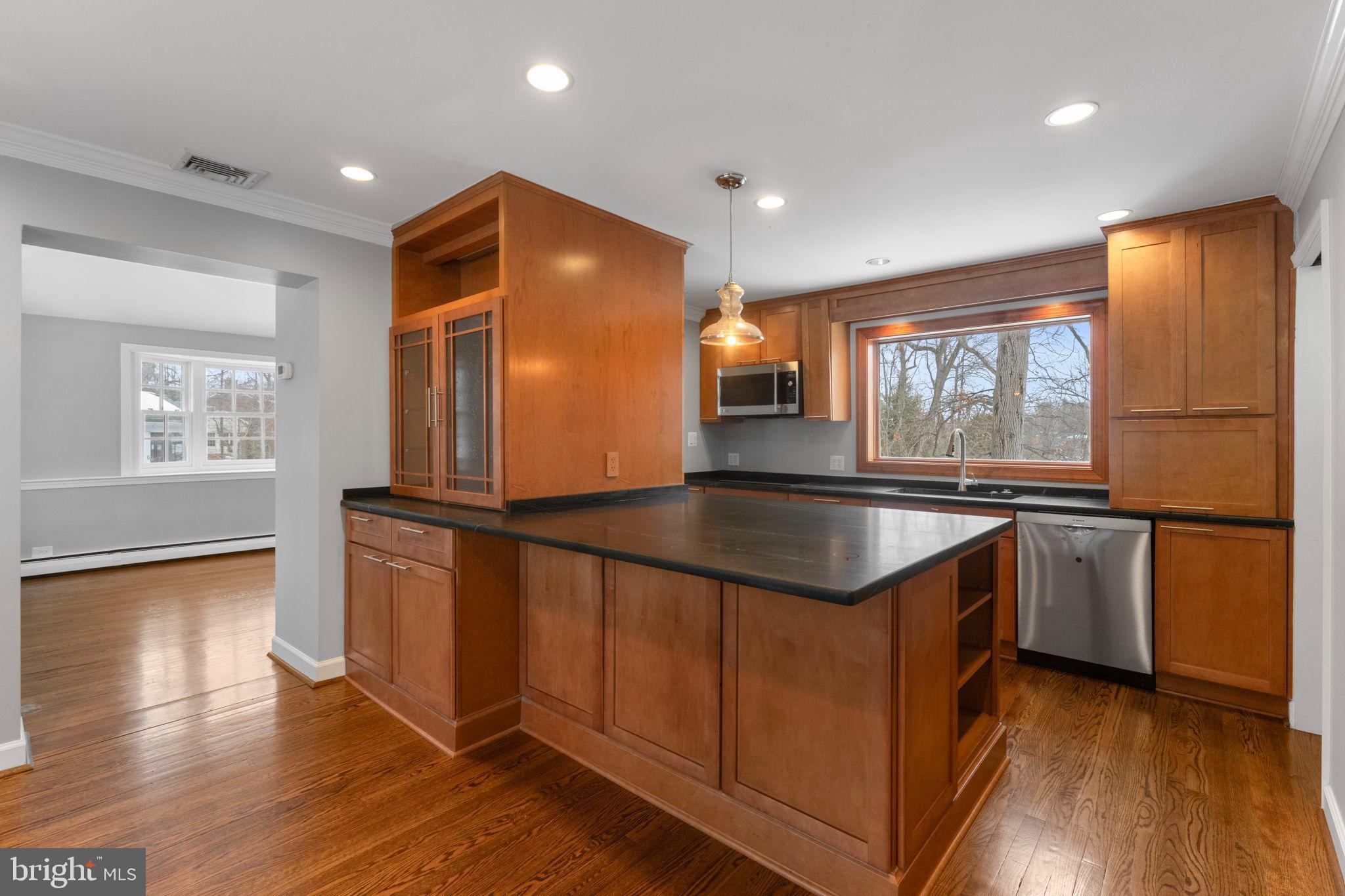 3207 Circle Hill Road Alexandria, VA 22305 - Photo 19 of 51 Modern kitchen with rich wood accents.