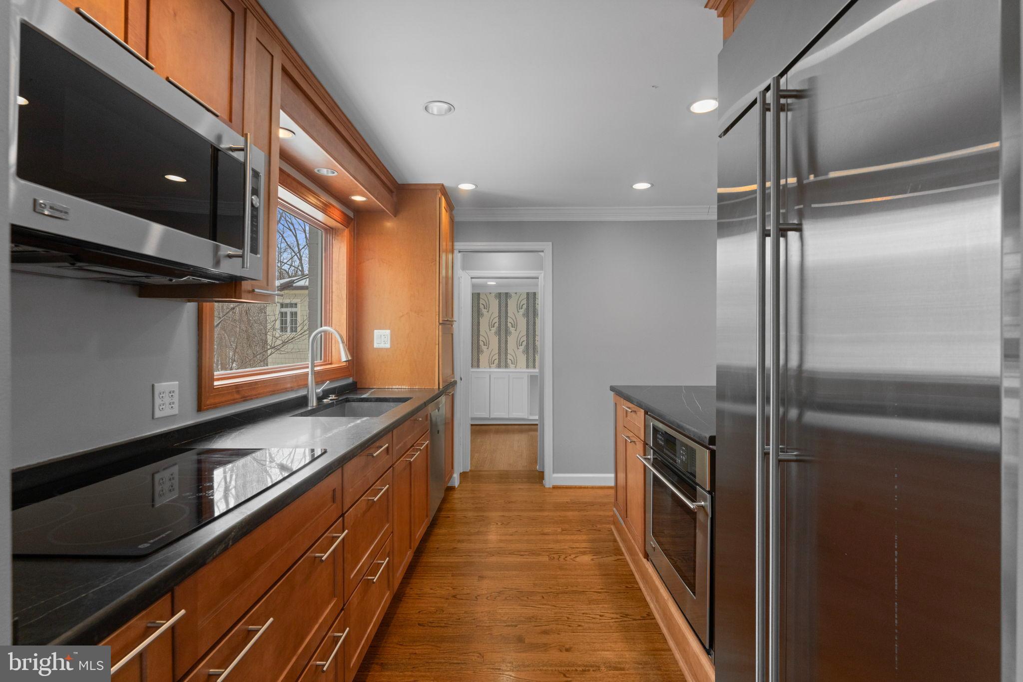 3207 Circle Hill Road Alexandria, VA 22305 - Photo 22 of 51 Sleek kitchen with warm wood accents.