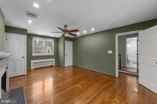 a view of livingroom with fireplace wooden floor and window