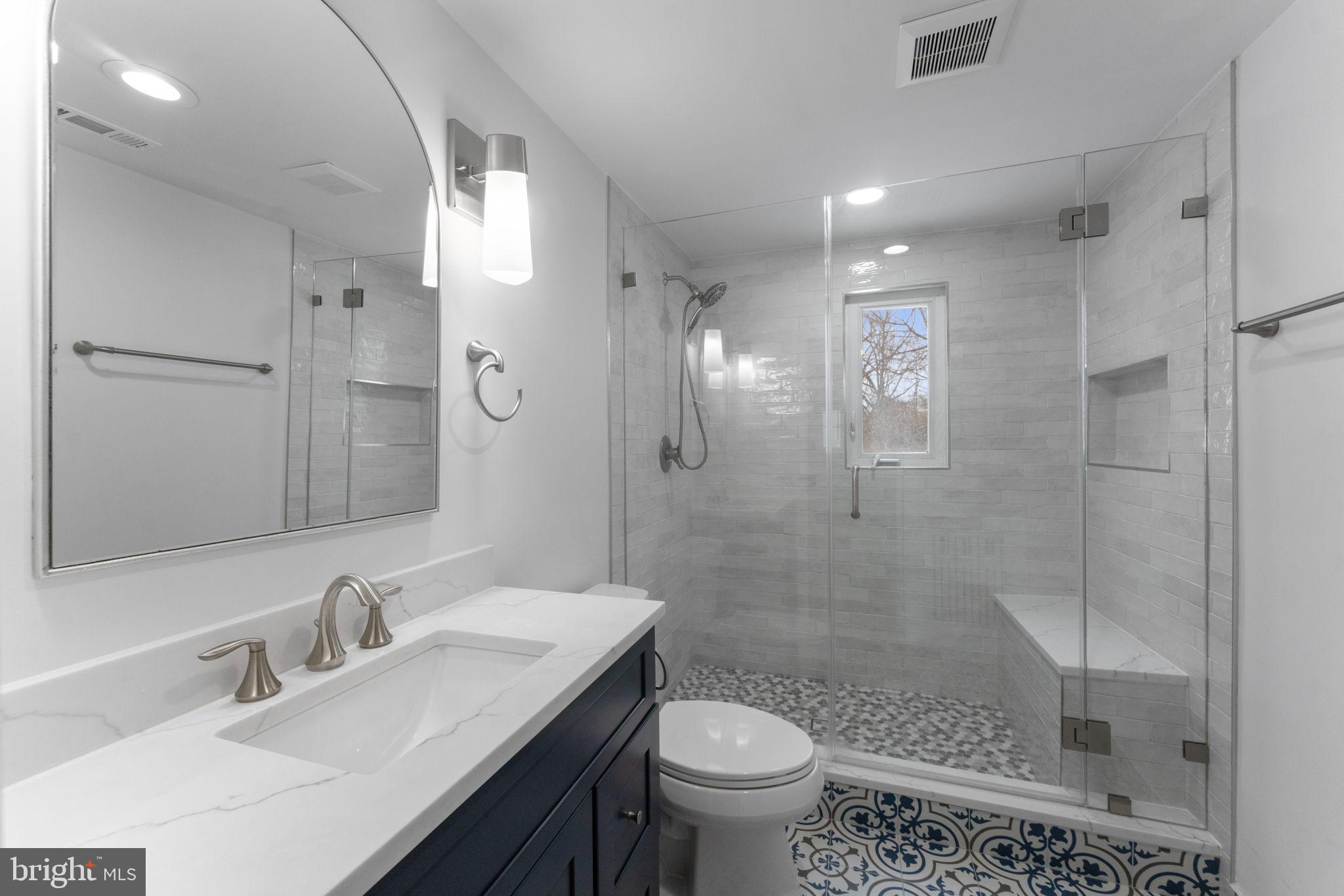 3207 Circle Hill Road Alexandria, VA 22305 - Photo 35 of 51 Sleek modern bathroom with elegant tiles.