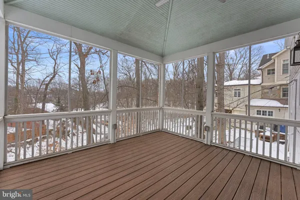a view of a porch with wooden floor