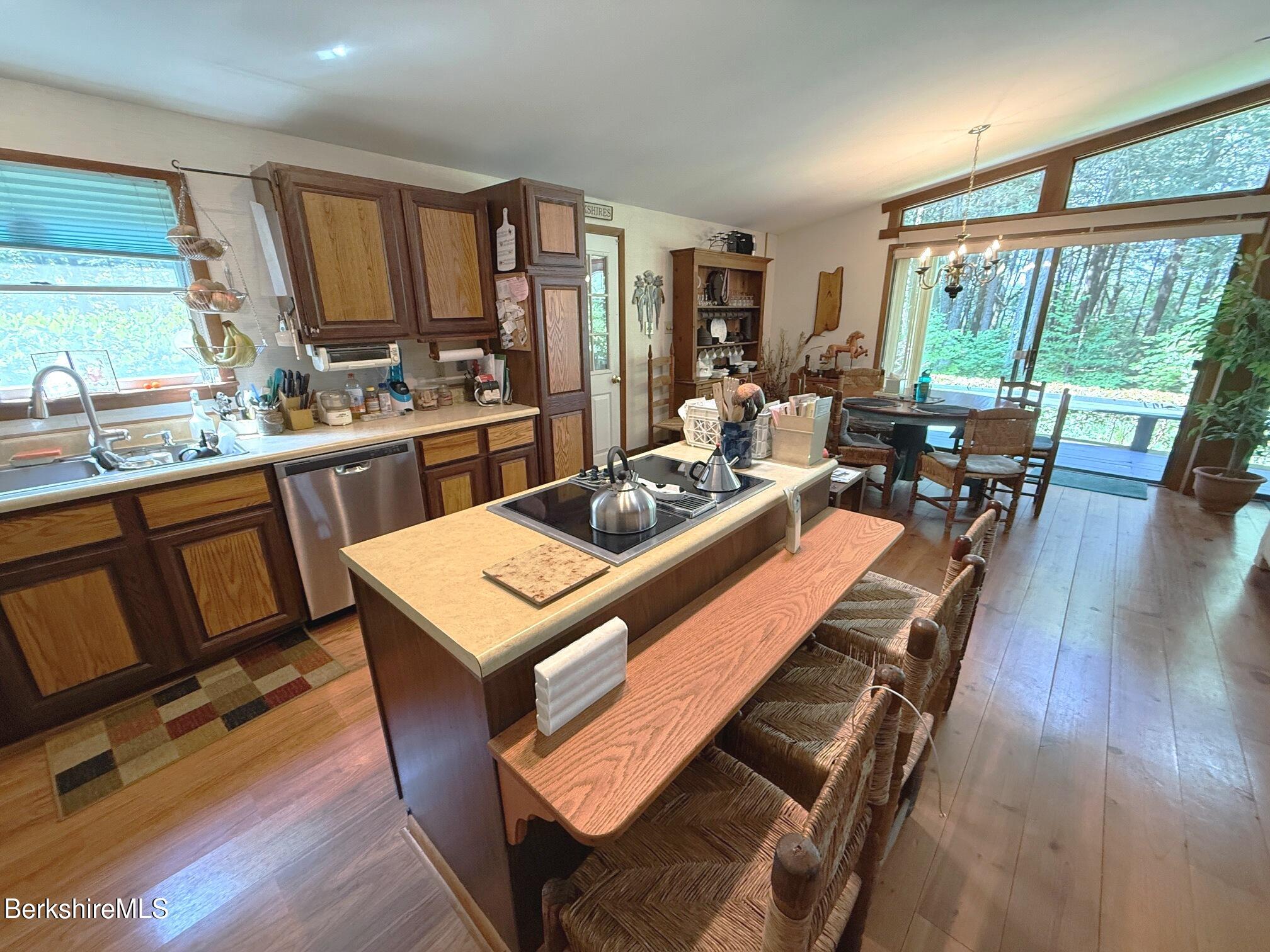 58 Evergreen Road Otis, MA 01029 - Photo 11 of 27 a living room with furniture a rug floor and a large window