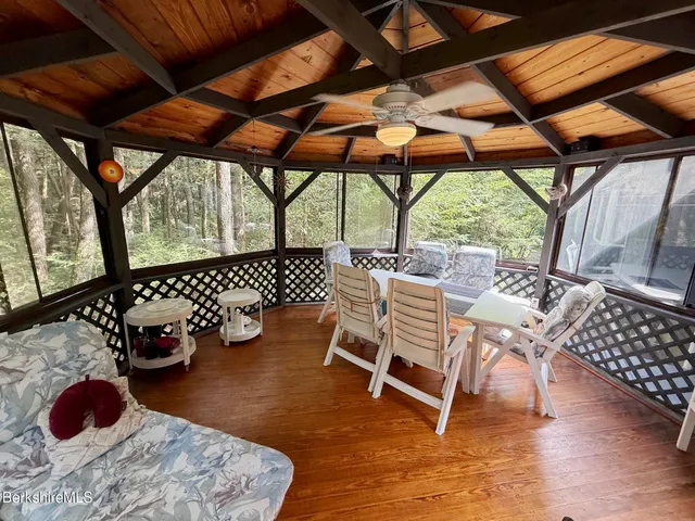 a view of a chairs and table in the patio