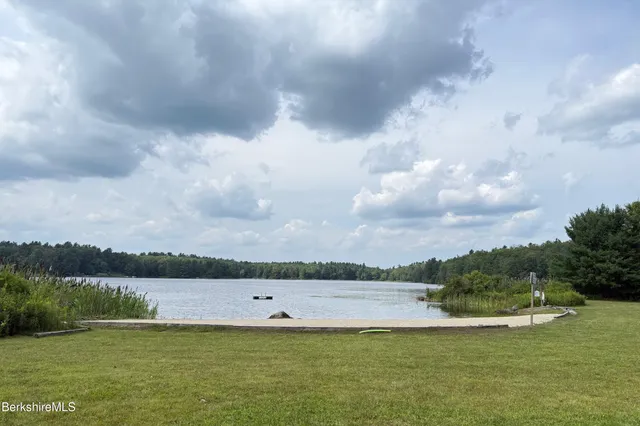 a view of a lake with houses in the back