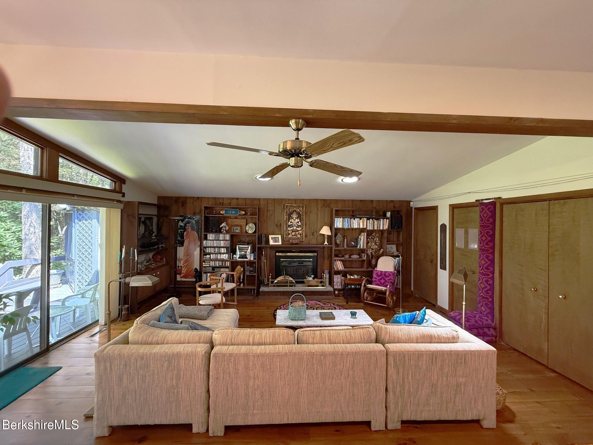 58 Evergreen Road Otis, MA 01029 - Photo 6 of 27 a room with furniture and a ceiling fan