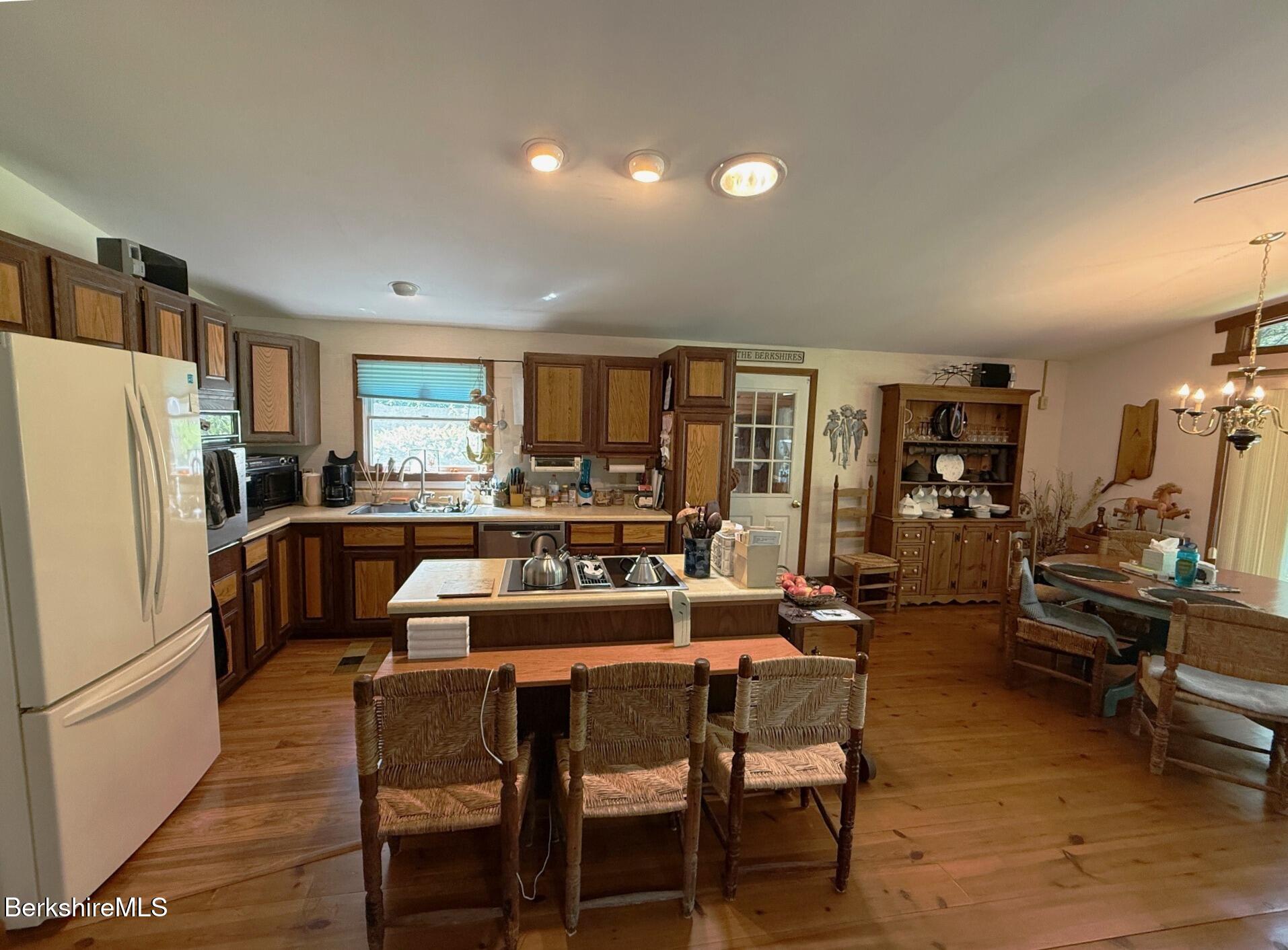 58 Evergreen Road Otis, MA 01029 - Photo 9 of 27 a view of a dining room with furniture window and wooden floor