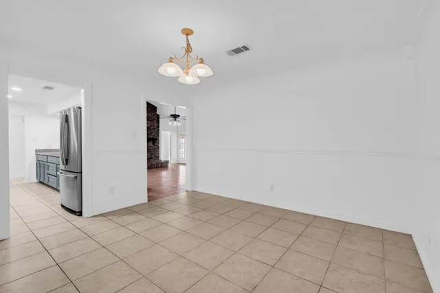 an empty room with a chandelier