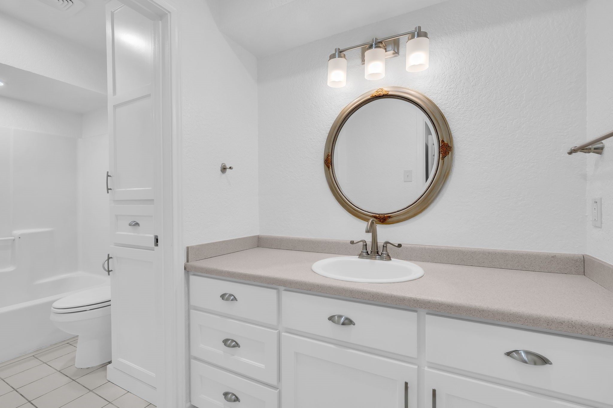 19811 Sagging Oaks Drive Spring, TX 77388 - Photo 23 of 36 a bathroom with a toilet a sink and a mirror