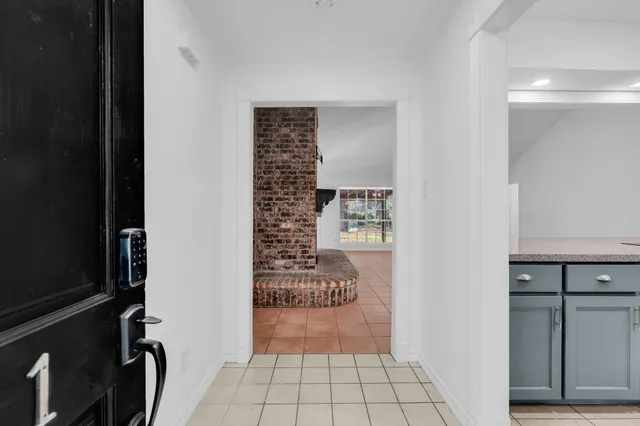 a view of entryway with kitchen